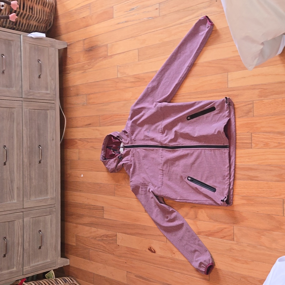 NWOT is a Heather Red, Rip Curl Anti-Series Full Zip Through Jacket. Supa Sic!!